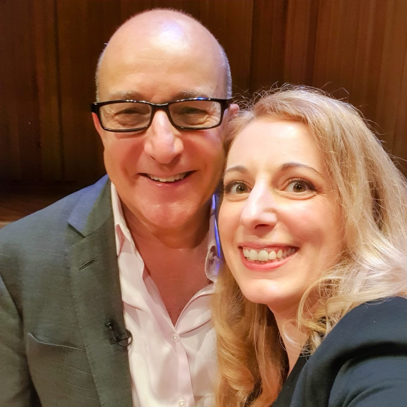 Paul McKenna and Rebecca Smiling Paul McKenna and Rebecca posing for a selfie in a professional setting.